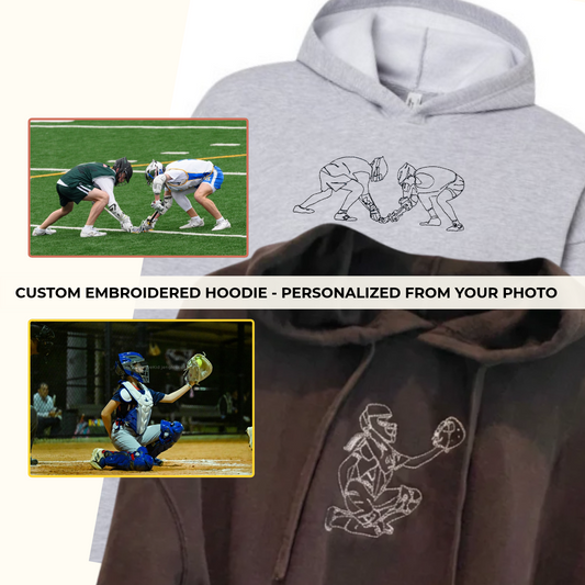 A light grey custom embroidered lacrosse hoodie and a black custom embroidered softball catcher hoodie.
