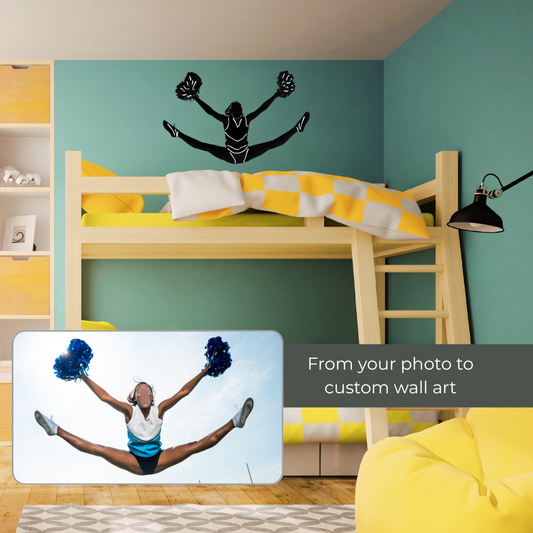 A bedroom with wooden twin bunk beds and a black & white cheerleader silhouette wall decal above the top bed. A smaller inset photo at lower left shows the original image of the cheerleader and text reading 'From your photo to custom wall art.